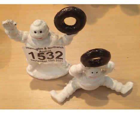 Two cast iron Michelin Man figures. P&amp;P Group 1 (£14+VAT for the first lot and £1+VAT for subsequent lots) 