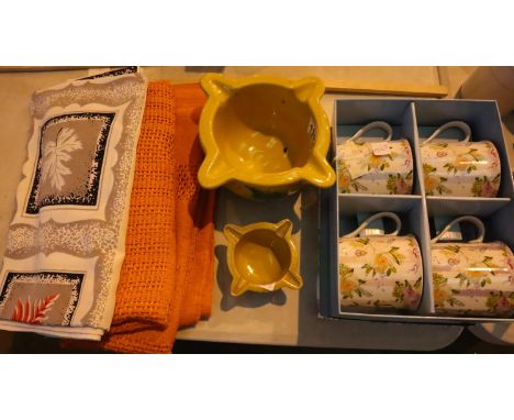 New boxed set of four floral patterned mugs, two vintage tablecloths and two vintage yellow mortars.  P&amp;P Group 2 (£18+VA