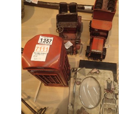A selection of reproduction items including tinplate bus, vintage car, telephone box and four ornate picture frames. Not avai