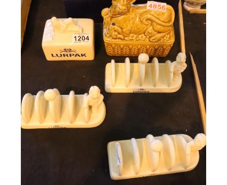 Three vintage Lurpak ceramic toast racks, a butter dish lid and a Sadler ceramic butter dish, with lid. Not available for in-