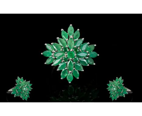 Emerald Starburst Cluster Ring, marquise cut emeralds spreading out into a layered starburst shape from a central round cut, 