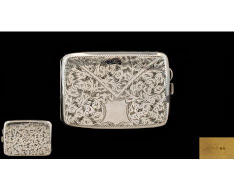 A Solid Silver Hinged Cigarette Case of Bowed Form with chased styalised floral decoration to front and back.  Vacant cartouc