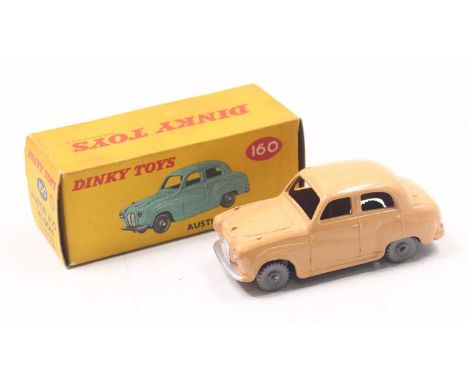 Dinky Toys No. 160 Austin A30 saloon comprising tan body with grey plastic wheels, housed in the original correct colour spot