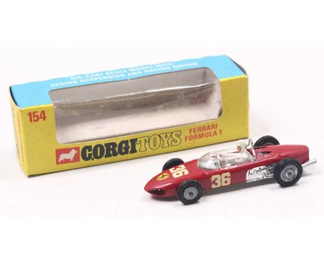 Corgi Toys No. 154 Ferrari Formula 1 Racing Car in red body, chrome interior and trim, cast hubs, figure driver, racing numbe