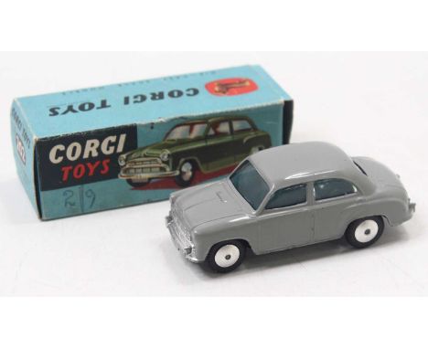Corgi Toys No. 202 Morris Cowley Saloon comprising a grey body with spun hubs, sold in its original blue card pictorial box w