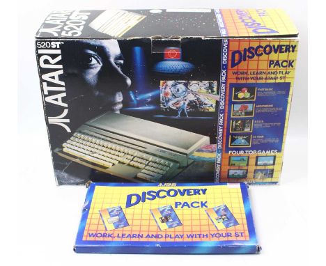 Atari 520ST Personal Computer comprising the charger cable, mouse, Discovery pack and a quantity of games, housed in a polyst