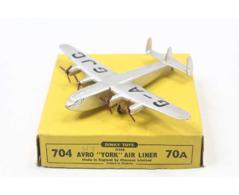 Dinky Toys, 704 Avro York air liner, silver body with 4x red 3 blade propellers, black G-AGJC to wings, in the original yello
