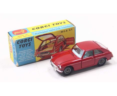 Corgi Toys No. 327 MGB GT saloon finished in red with light blue interior, wirework hubs, complete with original black suitca