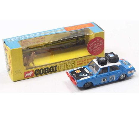 Corgi Toys No. 302 Hillman Hunter Rally Car in blue body with white roof, matt bonnet, kangaroo, RN75, with equipment to roof