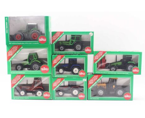 A collection of eight boxed Siku 1/32 scale diecast model tractors, to include No. 2861 Fiat 180-90 tractor, No. 2958 Deutz A