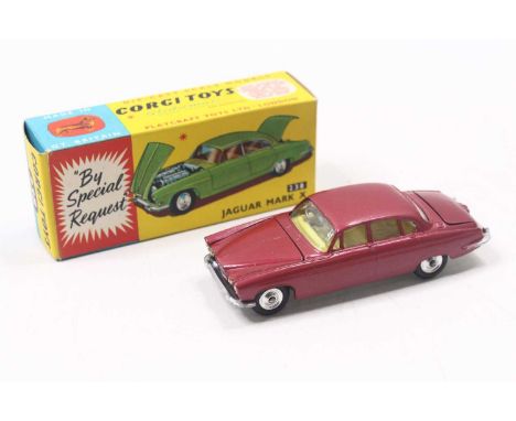 Corgi Toys No. 238 Jaguar Mk 10 comprising metallic cerise body with lemon interior, spun hubs with two pieces of luggage in 