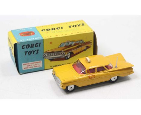 Corgi Toys No. 221 Chevrolet New York taxi cab in yellow with red interior and spun hubs, mint comes with a crisp, original b