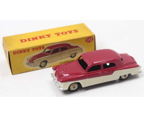 Dinky Toys, 172 Studebaker Land Cruiser, dark cerise over light cream body, cream rigid hubs, in the original all card correc