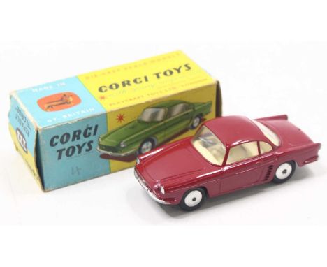 A Corgi Toys No. 222 Renault Floride in red body with cream interior and silver hubs, housed in the original all-card image b