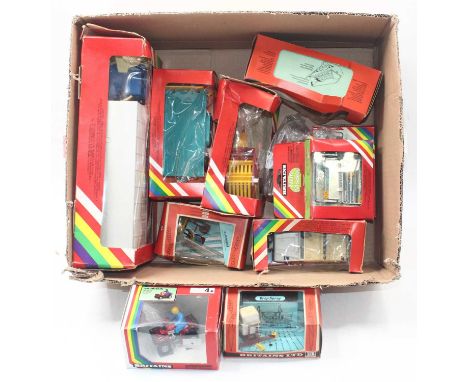 A collection of Britains farming related vehicles and accessories including a quad bike, an animal transporter, a Land Rover 