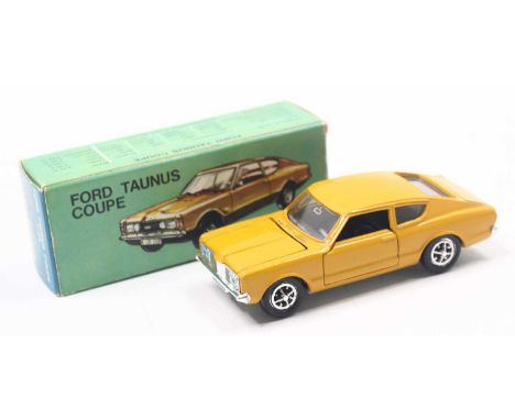 Gama No.995 Ford Taunus Coupe in yellow with black interior with chrome hubs, housed in the original card box (NM-M, BE)