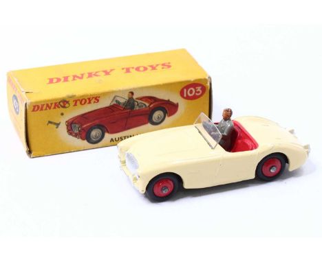 Dinky Toys No. 103 Austin Healey 100 sports car comprising cream body with red interior and red hubs and driver figure, house