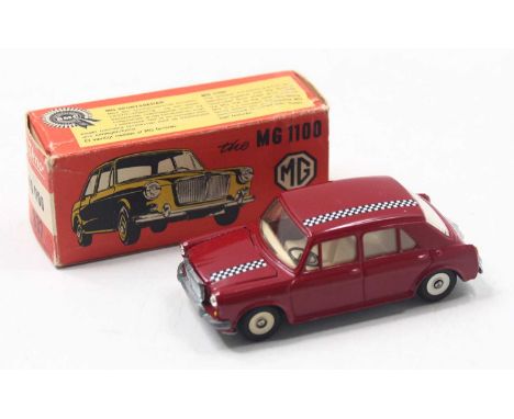 Tekno No.832 MG 1100 in red body with black chequered stripe transfers and cream interior, housed in a pictorial card box (E-