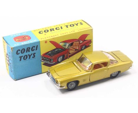 Corgi Toys No. 241 Chrysler Ghia L64 comprising of gold body with orange interior and cast hubs, rare example, housed in the 