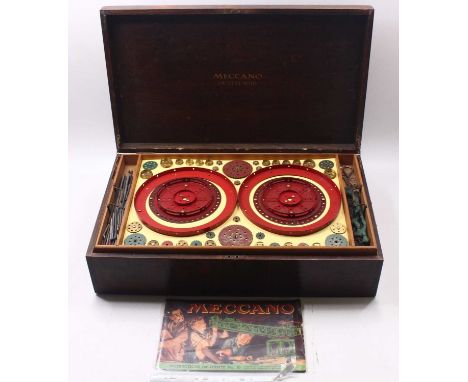 Meccano Outfit No.10 with mixed metal component parts in green, red and brass, includes straights, perforated strips, road wh