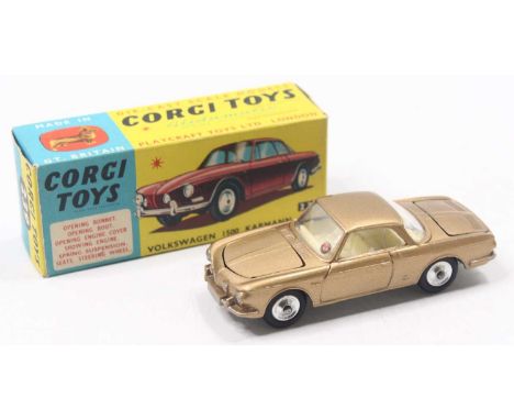 Corgi Toys No. 239 Volkswagen 1500 Karmann Ghia finished in gold with very rare white interior and spun hubs, housed in the o