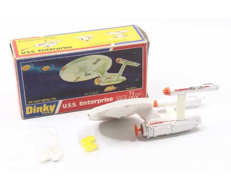 Dinky Toys No. 358 U.S.S. Enterprise from the TV show Star Trek in white with 4 yellow disks and 8 in white, shooting mechani