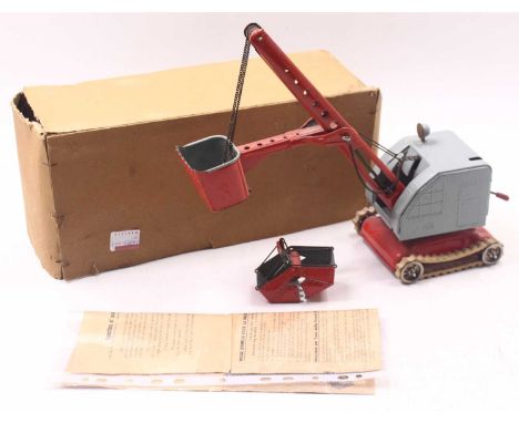 MFZ (Germany) No.3020 Tinplate Mechanical Crab Crane Having a grey cab with red jib and tan rubber crawling tracks, a loose e