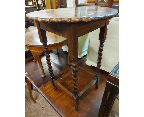 A 47cm vintage oak occasional table, set on barley twist supports