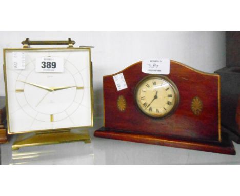 A vintage Swiza heavy brass cased alarm clock - sold with a small early 20th Century timepiece