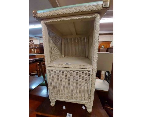 A 40cm vintage loom style bedside cabinet with glass inset top, recess and cupboard door under