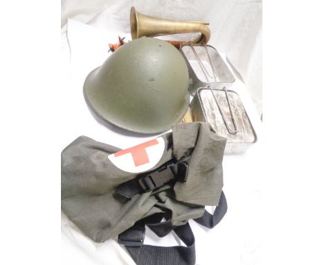 A small selection of military related items comprising helmet, bugle and two billy cans