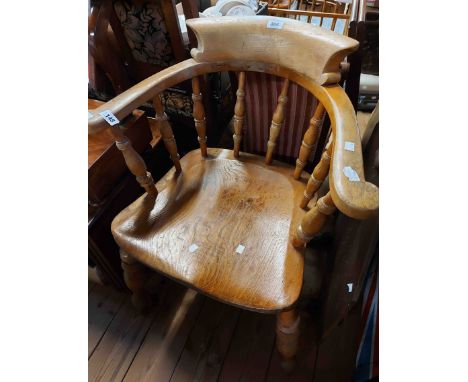 A vintage varnished wood smoker's bow elbow chair with moulded solid elm seat, set on ring turned supports - repair