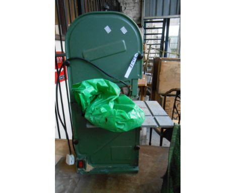 A vintage green painted electric bandsaw - sold with a quantity of replacement blades