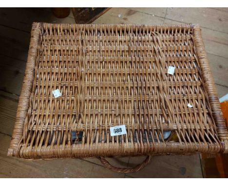 A wicker hamper containing a quantity of artists' equipment including paints, brushes, etc.