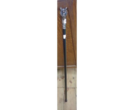 A modern metal walking stick with claw and glass ball form handle