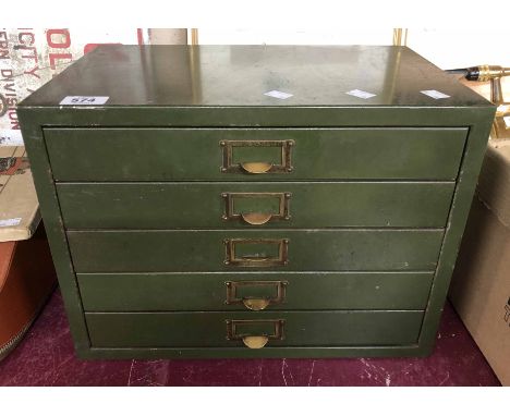A vintage metal desktop five drawer filing chest with original green painted finish and brass handles