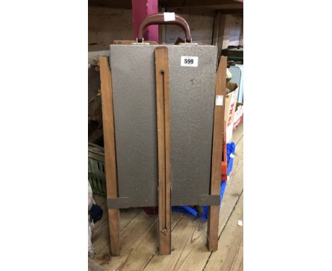A vintage artist's folding easel and paintbox with slide out palette and Bakelite carry handle