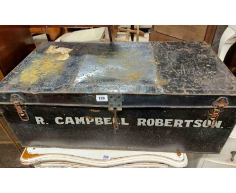 An 85cm vintage black lacquered tin transit trunk with name to front