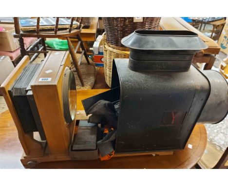 A large TCA Dresden Magic Lantern projector with wooden bellow slide arrangement and tin plate back, with original back cowl 