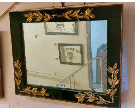An 80cm vintage decorative wall mirror with applied gilt foliage to green velvet border