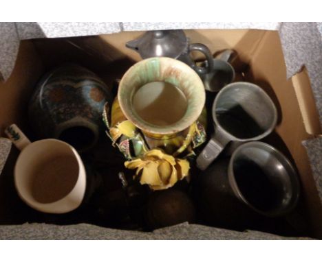 A box containing a quantity of ceramic items and pewter ware including tankards, jugs, etc.