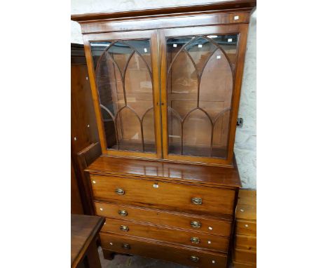 A 1.3m 19th Century mahogany two part secretaire/bookcase with moulded cornice and shelves enclosed by a pair of Gothic beade