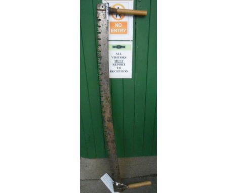 A vintage 5 ft two handled crosscut saw - by Disston
