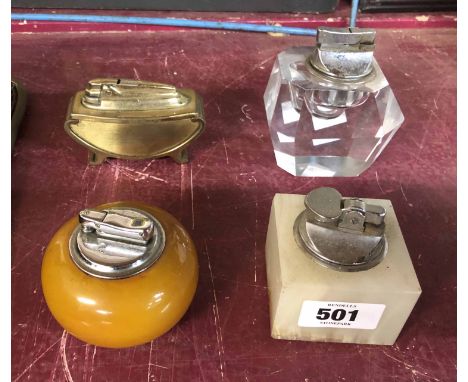 A vintage table lighter with butterscotch phenolic base and a similar with large faceted glass base - sold with a Ronson bras