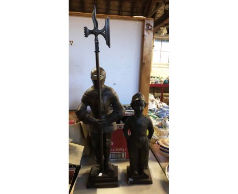A vintage cast iron companion set of knight form with brush and tongs to rear holding a large axe form poker - sold with a co