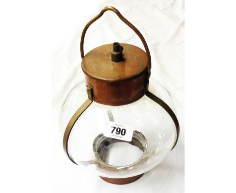 An old hanging hall lantern of ship's lamp form, the blown glass shade enclosed by a copper cage