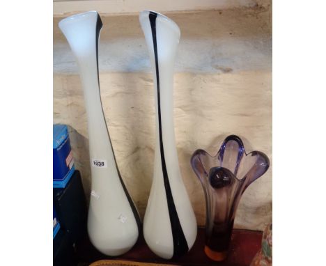 A pair of large freeform glass vases with internal white and black enamel decoration - sold with another glass vase