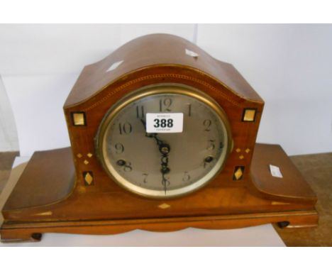 A vintage inlaid mahogany cased mantel clock with eight day chiming movement