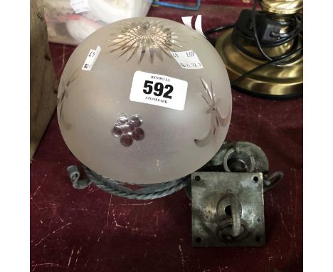 An early 20th Century hanging hall light with metal cage and cut and frosted glass shade and fittings