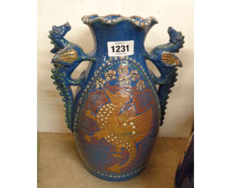 A large Harry Juniper of Bideford pottery vase made as a homage to a C.H. Brannam original with a central panel depicting a d